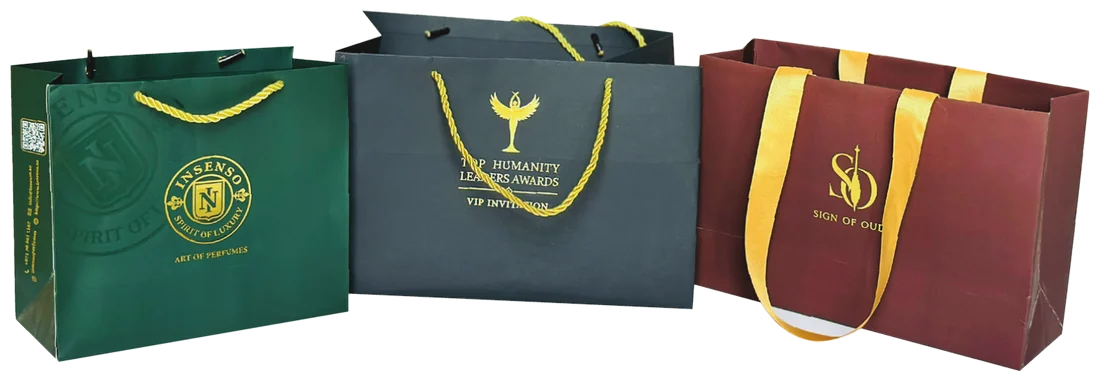 Luxury paper bags in green, grey and burgundy with gold foil marks